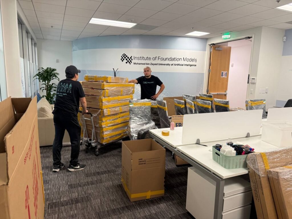 Office move in progress with moving crates and furniture inside a Bay Area office