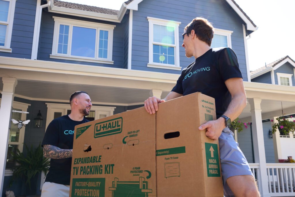 CEO Moving crew carrying boxes into a new home
