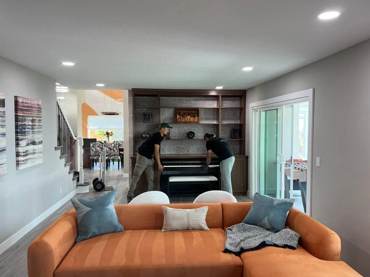 CEO Moving crew preparing to move an upright piano in a Bay Area home